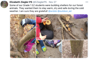 Students building small structures using sticks and small branches